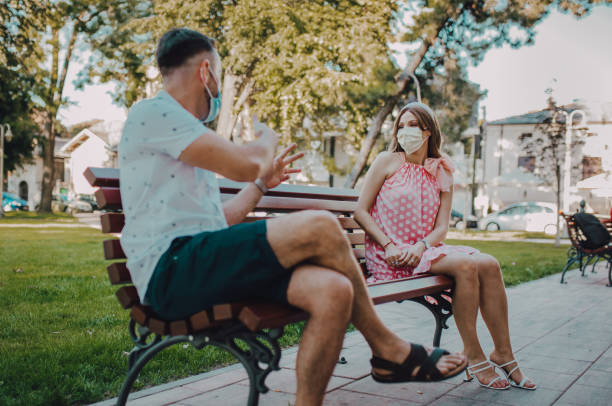 istock Corona couple on the bench 1268696698