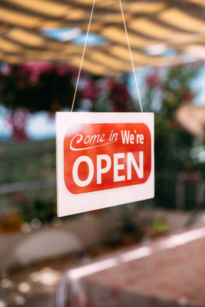 istock Come in We’re Open Sign on the Window 1268697992
