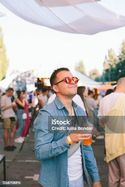 Hip Man Standing Out For The Crowd Stock Photo - Download Image Now - Tomorrowland - Music Festival, Film Festival, Music