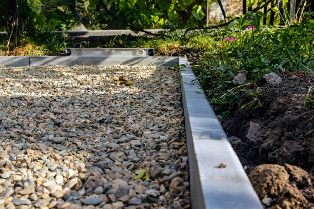 istock The sidewalk is under construction. Concrete curb and crushed stone base. Preparation for laying tiles. Selective focus 1268709258