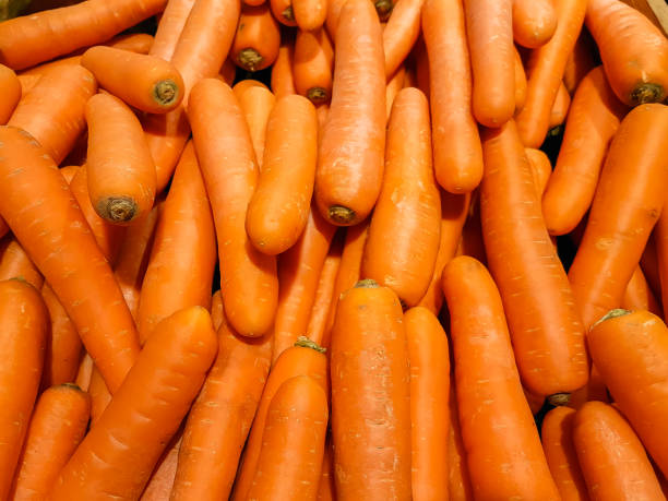 istock Lot of fresh ripe carrots. 1268710462