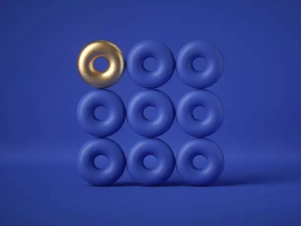 3d render, abstract geometric design: golden torus amongst the blue donuts isolated on blue background. Balance, gravity, one of a kind exception concept. Matrix of primitive shapes