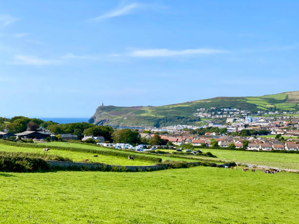 istock Green fields and Port Erin, Isle of Man 1268712035