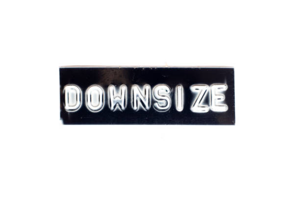 istock Embossed letter in word downsize in black banner on white background 1268717275