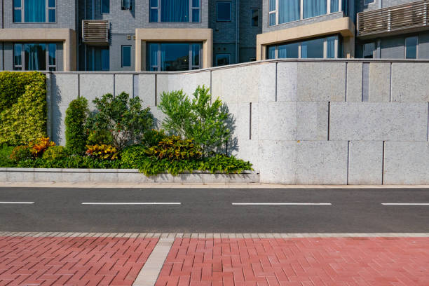 istock White empty brick cracked wall background on sidewalk of city 1268719339