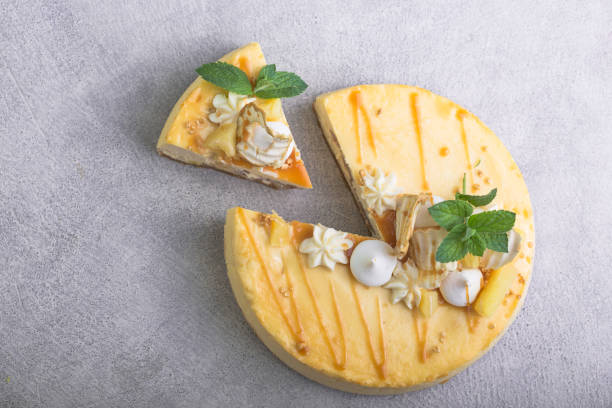 istock Caramel apple pear cheesecake. Close up side view stone kitchen table, side view. Autumn dessert. 1268720968
