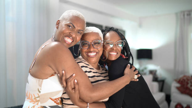 istock Friends embracing at home 1268721133