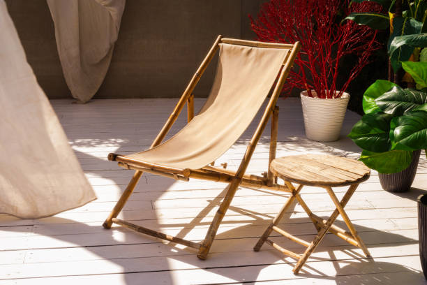 istock Comfortable bamboo chair and table, plants outdoor. 1268724769