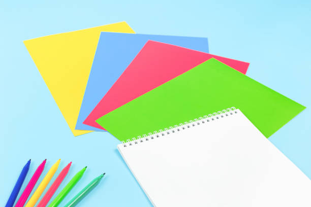 istock Color paper, paint and school stationery on blue 1268726540