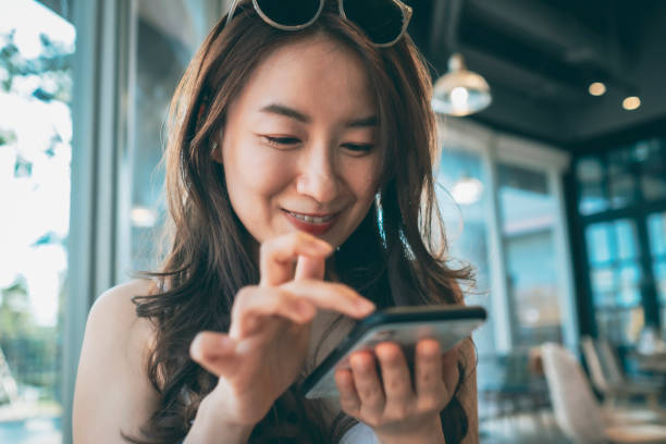 istock young Asian woman working in cafe 1268729219