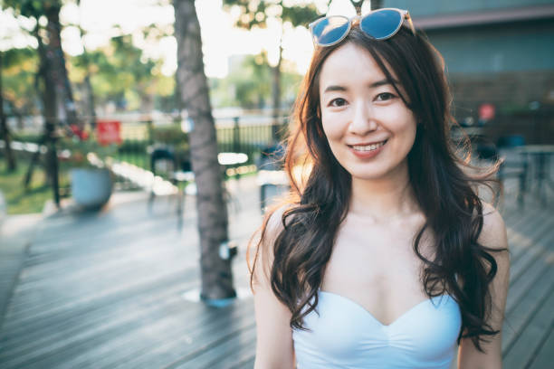 istock Asian Woman Looking At The Camera 1268729228