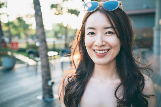 istock Asian Woman Looking At The Camera 1268729242