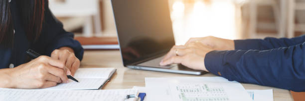 istock Business people working together with financial project. 1268731582