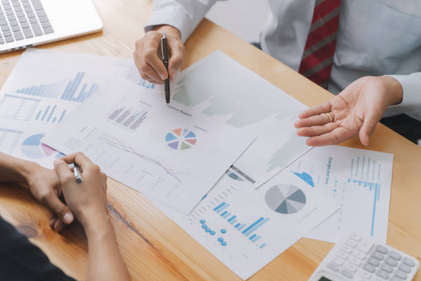 istock Financial inspector calculating a numbers in office room. 1268731603