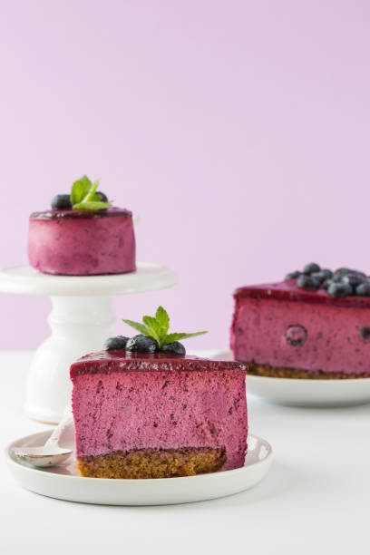 istock Blueberry mousse cake, cheesecake with fresh blueberry on white plate with mint leaves 1268733260