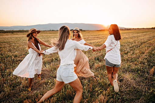 Girls having fun in meadow