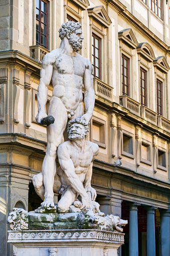 Florence, Italy -- The marble statue of Hercules and Caco, by the sculptor Baccio Bandinelli, on front of the Palazzo Vecchio, in Piazza della Signoria. Palazzo Vecchio its a symbol of political power of the Medici dynasty and actually seat of the Florence Municipality. Palazzo Vecchio, built between 1299 and 1314 to give a seat to the Priors of the Arts, the representatives of the professional corporations that governed the city, was converted from 1540 into the seat of the Medici family at the behest of Grand Duke Cosimo I. Image in High Definition format.