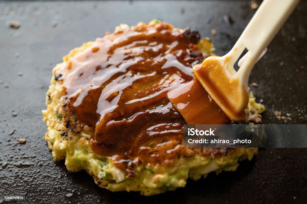 Okonomiyaki, japanese teppan-yaki pancake Sauce Stock Photo