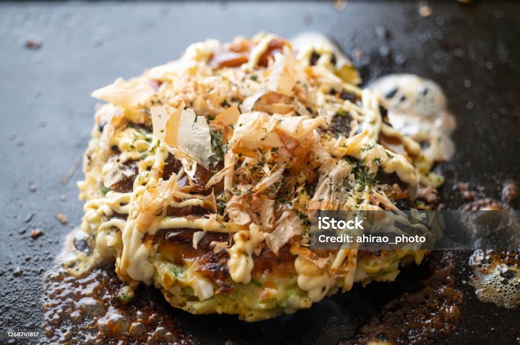 Okonomiyaki, japanese teppan-yaki pancake Okonomiyaki Stock Photo