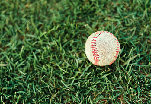 Shot of a baseball lying on a field