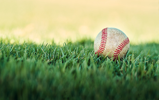 Shot of a baseball lying on a field