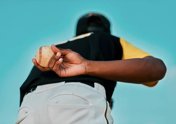 I hope you have what it takes! Rearview shot of a baseball player holding the ball behind his back baseball pitcher baseball player baseball diamond stock pictures, royalty-free photos & images