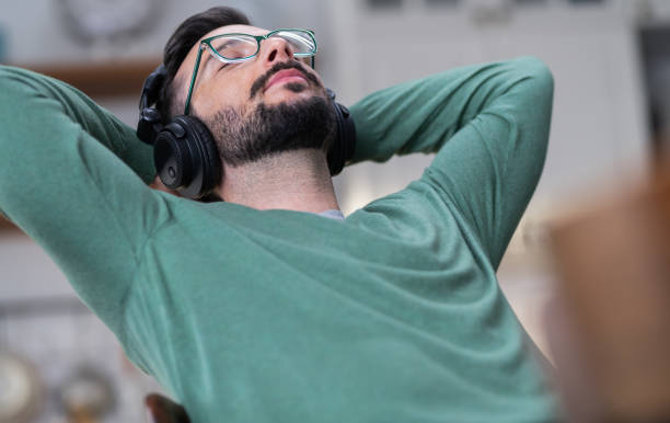 istock Young Man Listening Music 1268762993