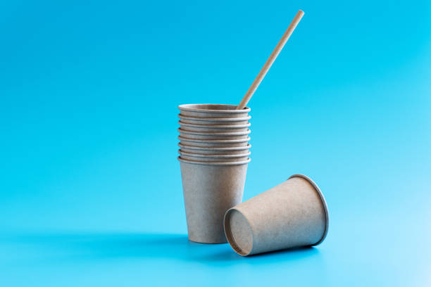 istock Stack of disposable paper cups on blue background. Eco-friendly tableware. Recycling concept. Zero waste theme. Copy space. 1268765979