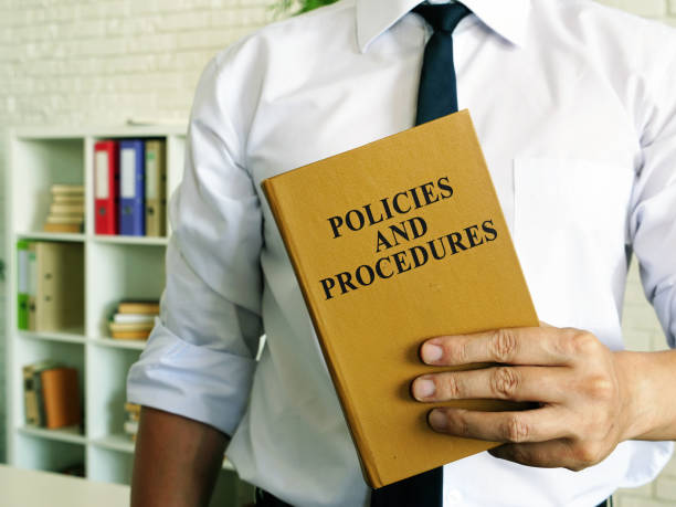 istock The manager offers Policies and procedures book. 1268778431