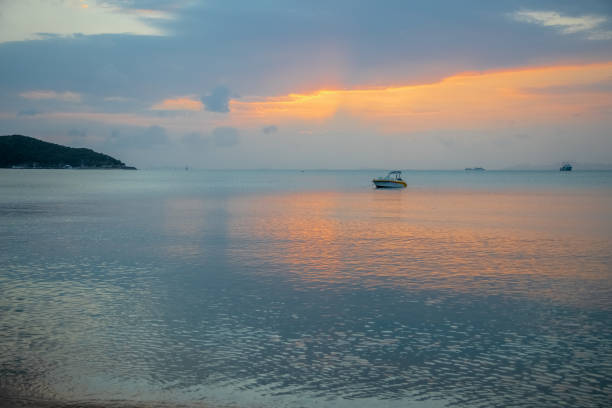 istock A Sailing Boat with Misty Sunset and Reflection on Water 1268785814