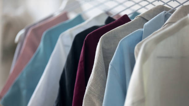 istock Close up new clothes hanging on rack in atelier. 1268788580
