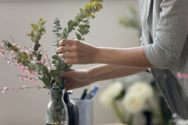 istock Close up decorator making floral composition for sale. 1268788595
