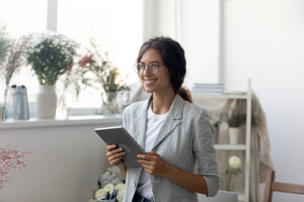 istock Happy young dreamy woman thinking of future challenges. 1268788611