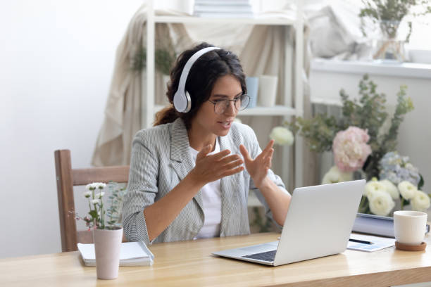 istock Young creative businesswoman enjoying video call conversation. 1268788646