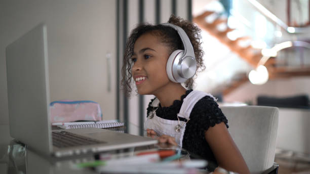 istock Girl studying on a video call at home 1268789393