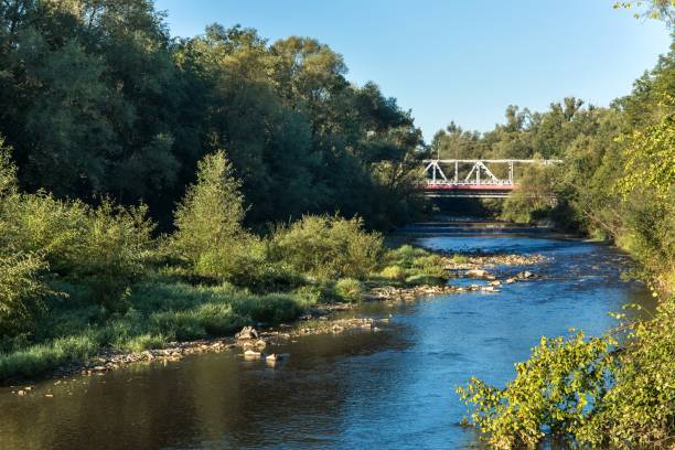 istock Bridge over the river. Summer morning over the river. Landscape with a calm river. Romantic morning. A place for fishing. 1268791897