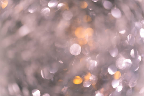 istock bright christmas bokeh. iridescent glare silver 1268792264