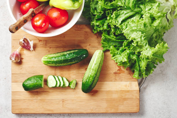 istock Fresh vegetables on a cutting board, salad ingredients. 1268793732