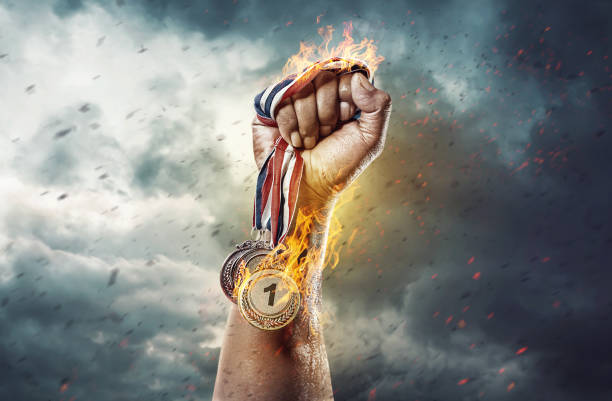 istock Medal for the first place on sky background. Victory concept. Fire and energy 1268804030