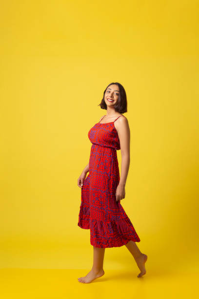 istock Cheerful young beautiful girl dances with happiness. 1268805021