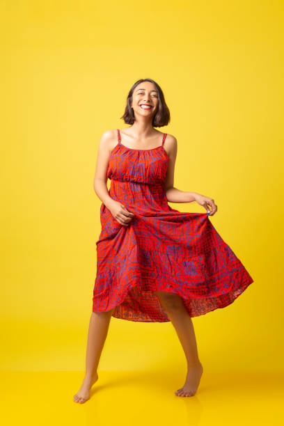 istock Cheerful young beautiful girl dances with happiness. 1268807563