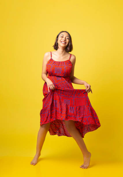 istock Cheerful young beautiful girl dances with happiness. 1268808919