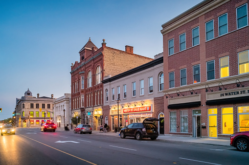 Stores and businesses in downtown Cambridge Ontario Canada at twilight.