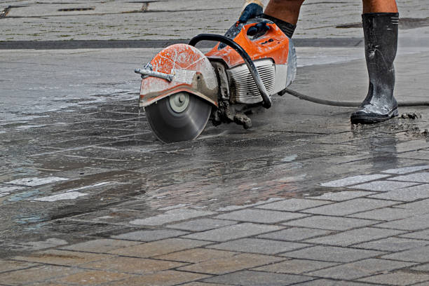power cutter in action on a construction site in the city stock photo