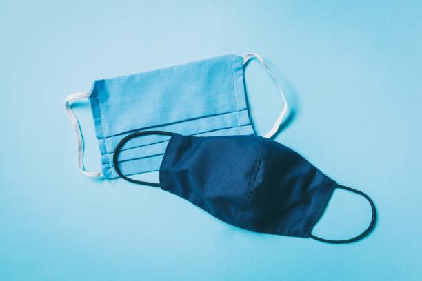 istock Coronavirus COVID-19 protection. Two handmade sew protective masks with multiple layers. New face covering rules 1268821990