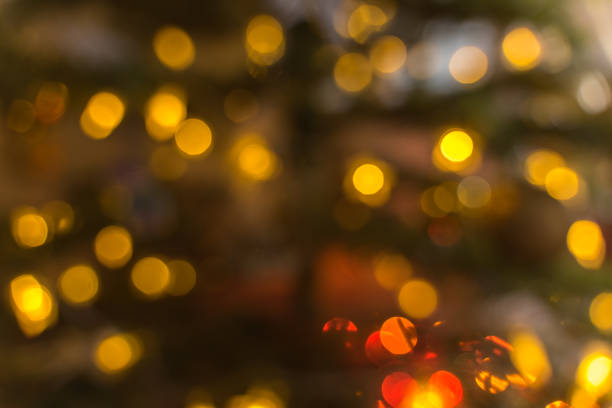 istock fantasy christmas blurred background with luminous fire and christmas tree 1268829561