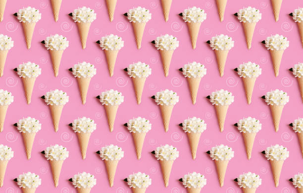 istock Waffle ice cream cone with jasmine flowers on a pink background. Summer concept 1268830087
