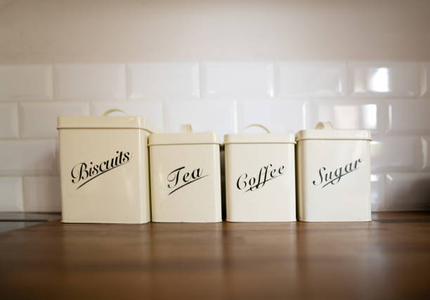 Row of storage tins on a kitchen worktop