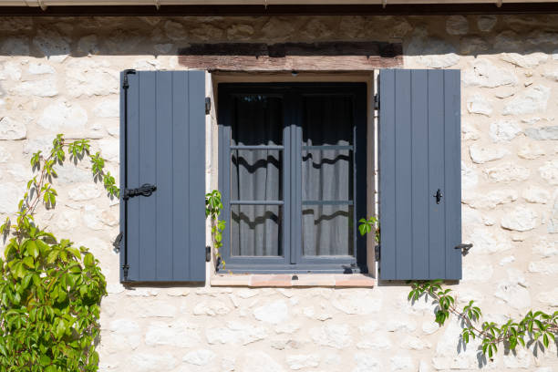 Open wooden window shutters stock photo