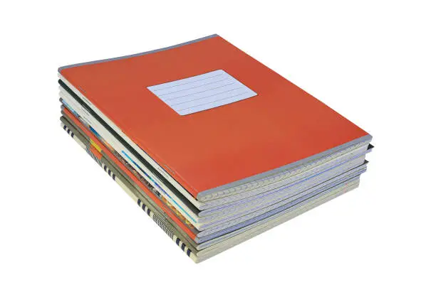 Photo of stack of school notebooks is isolated on a white background